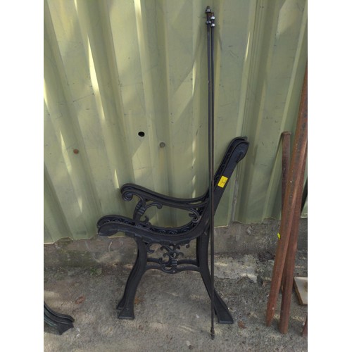 5 - Black-painted metal garden bench ends with stretcher