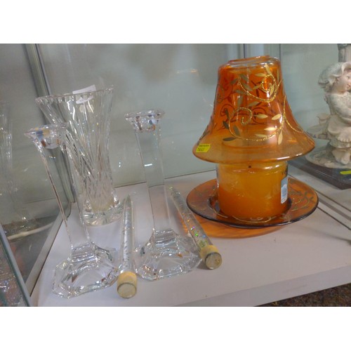 619 - Two cut glass candlesticks, cut glass vase and a glass candle globe with a Yankee candle.