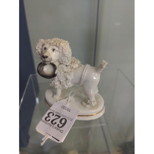 623 - Staffordshire porcelain poodle, circa 1835-50, modelled holding a hat in its mouth, height 6.5cm