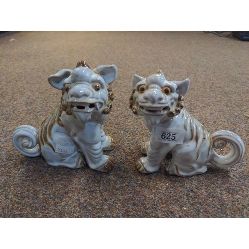 625 - Pair of Foo Dogs in ceramic markings to base.