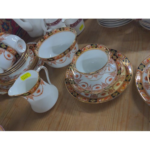 665 - Royal Albert tea ware with cups and saucers and plates with a milk jug and sugar bowl.