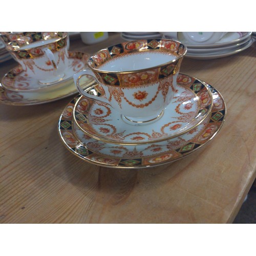 665 - Royal Albert tea ware with cups and saucers and plates with a milk jug and sugar bowl.