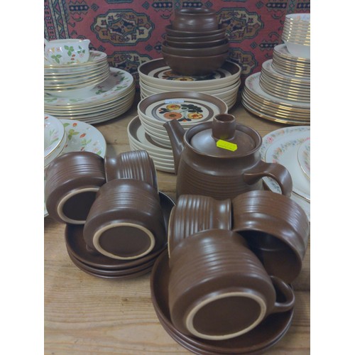 670 - Denby style brown small tea cups and coffee pot plus, plates, bowls etc..,