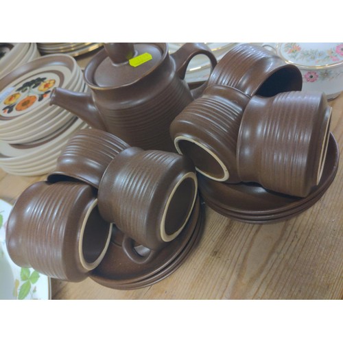 670 - Denby style brown small tea cups and coffee pot plus, plates, bowls etc..,