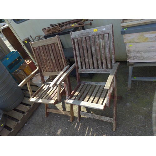 67 - Pair of teak folding chairs