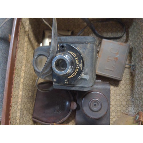 688 - Small brown case containing Various collectables Inc Bakelite V.P.Twin camera, Ensign Camera, Austra... 