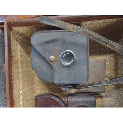 688 - Small brown case containing Various collectables Inc Bakelite V.P.Twin camera, Ensign Camera, Austra... 