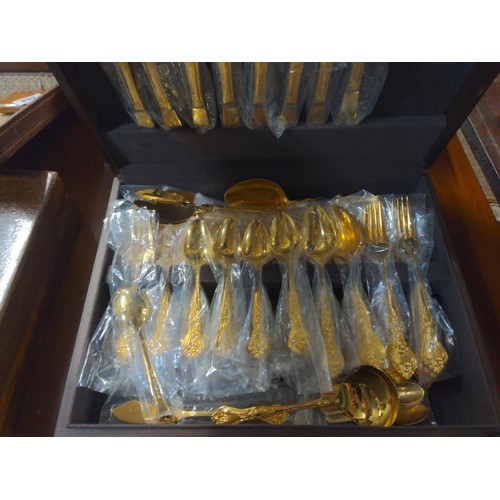 690 - Korean gilt canteen of cutlery.