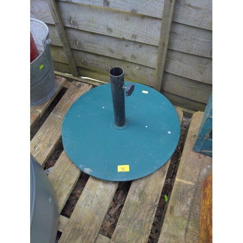 75 - Metal parasol stand.