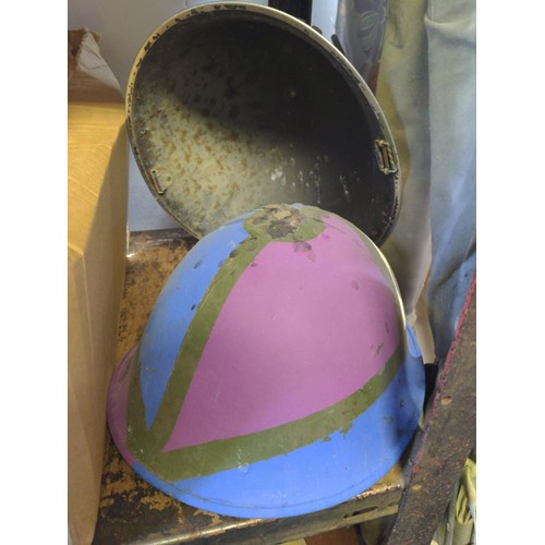 216 - 2 military helmets (decorated)