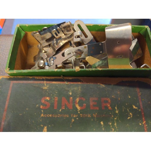 254 - Electric singer sewing machine (no plug) with handbooks and accessories in case.