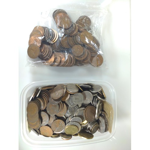 493 - Tub of mixed British and world coins, gross weight including tub 3.34kg