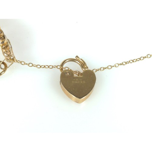 523 - 9ct gold gate link bracelet with heart-shaped clasp and safety chain, gross weight 6.75 grams