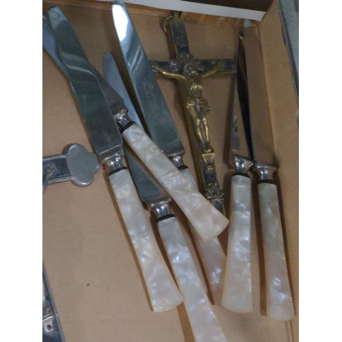 570 - Collection of crucifixes and a set of six 'Pearlcraft' stainless knives