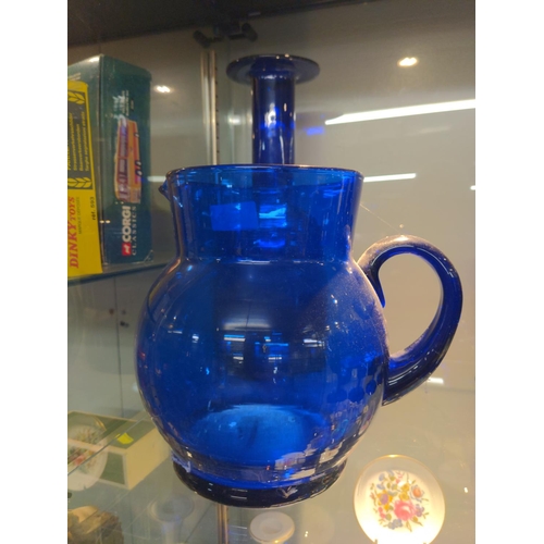 638 - Coloured glass, Medina vase 12 cm, two blue glass jug and vase H 31 cm