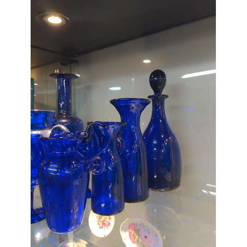 639 - Collection of deep blue glass consisting of 5 goblets, decanter, two vases and one jg marked Bristol... 