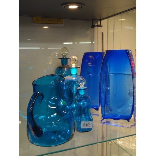 640 - Lightblue graduated decanters and a large jug in same colour, plus two dark blue glass modern design... 