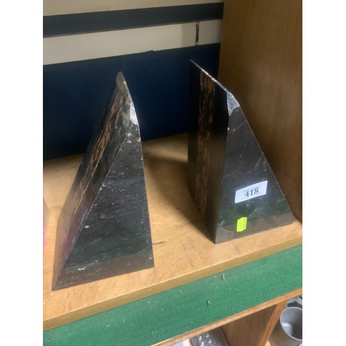 418 - Pair of polished stone angular books ends.