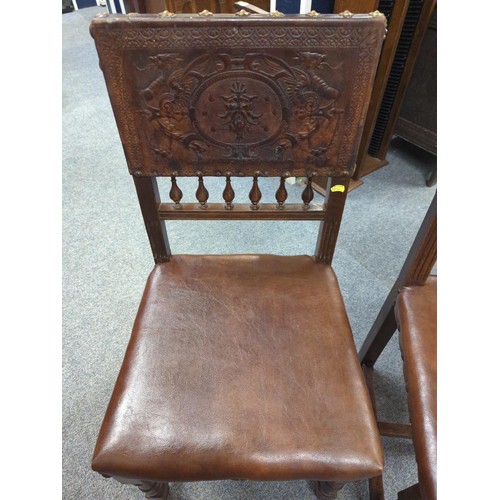 847 - Pair of worked leather dining chairs