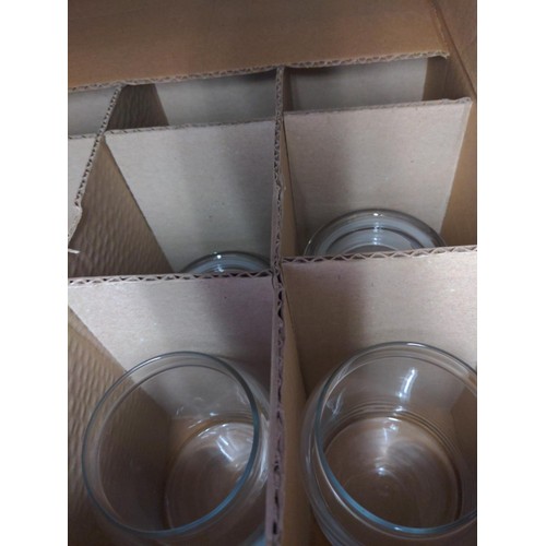 283 - 4 boxes of new Libbey 70997 glass storage jars with lids. Good for candle making.