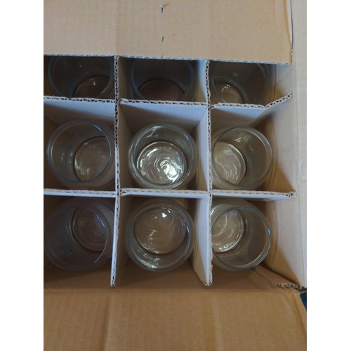 283 - 4 boxes of new Libbey 70997 glass storage jars with lids. Good for candle making.