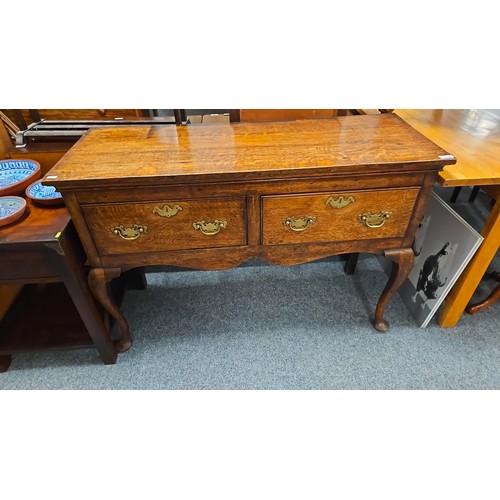 837 - Oak sideboard with two deep drawers with brass drop handles and escutcheons W120 x D46 x H83cm