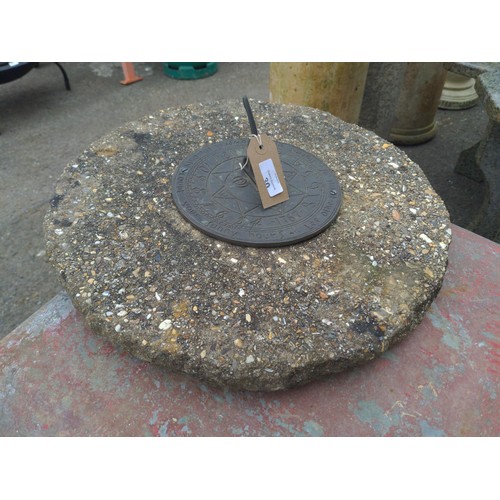 30 - Metal sundial top mounted on stone. D42cm