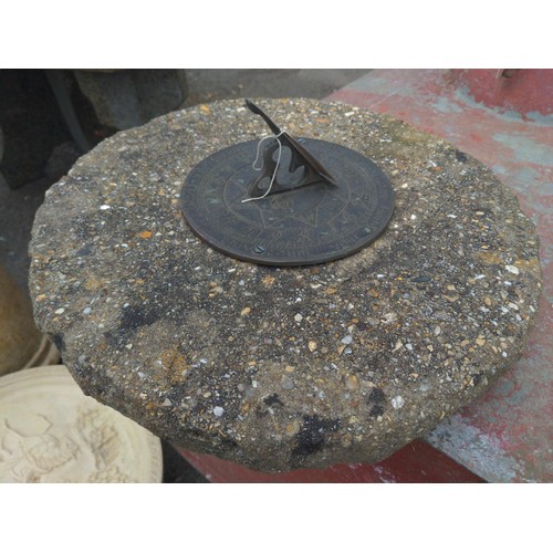 30 - Metal sundial top mounted on stone. D42cm