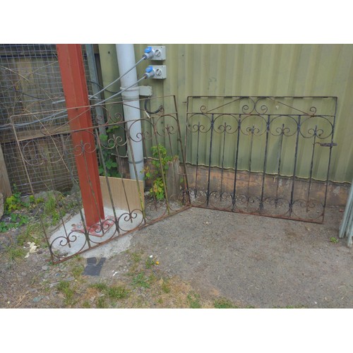 59 - Pair of wrought metal scrolled driveway gates. to fit opening 262cm to centre hinge.