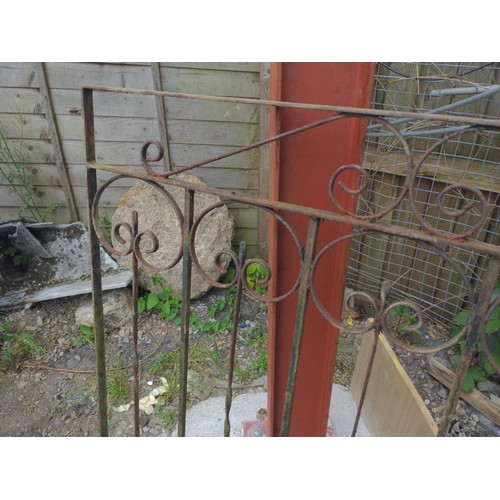 59 - Pair of wrought metal scrolled driveway gates. to fit opening 262cm to centre hinge.