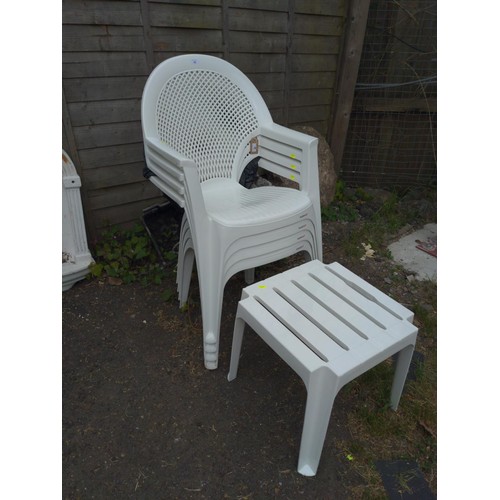 60 - 4 plastic stacking patio chairs with small table by Alibert.