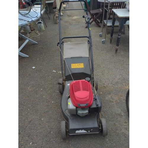 63 - Honda GCV135 petrol lawn mower. (sold in working order)