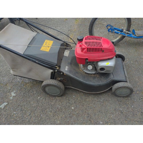 63 - Honda GCV135 petrol lawn mower. (sold in working order)