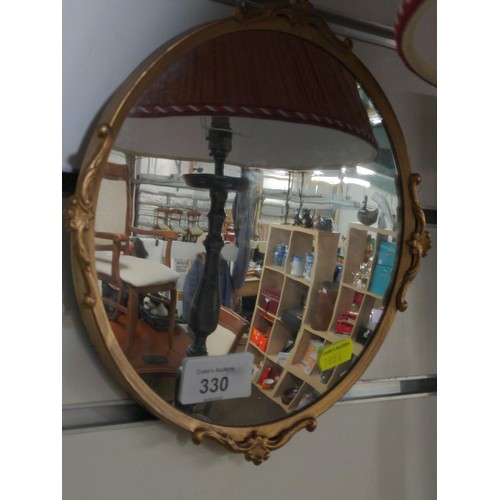 330 - Circular convex gilt framed mirror with 22.5cm diameter