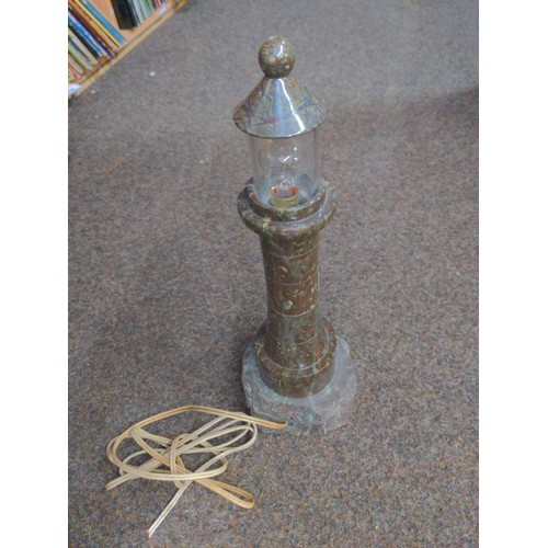 334 - Red serpentine based lighthouse lamp on granite. 35cm