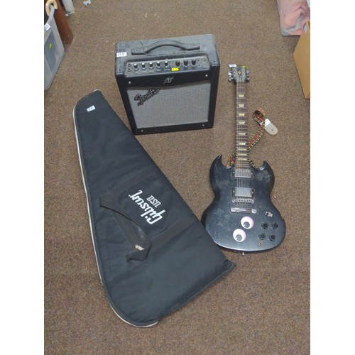 568 - Gibson soft case for guitar, plus black electric guitar in the style of a Gibson SG, along with a Fe... 