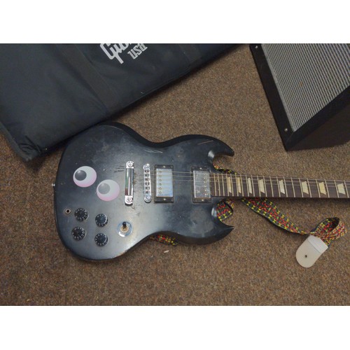 568 - Gibson soft case for guitar, plus black electric guitar in the style of a Gibson SG, along with a Fe... 