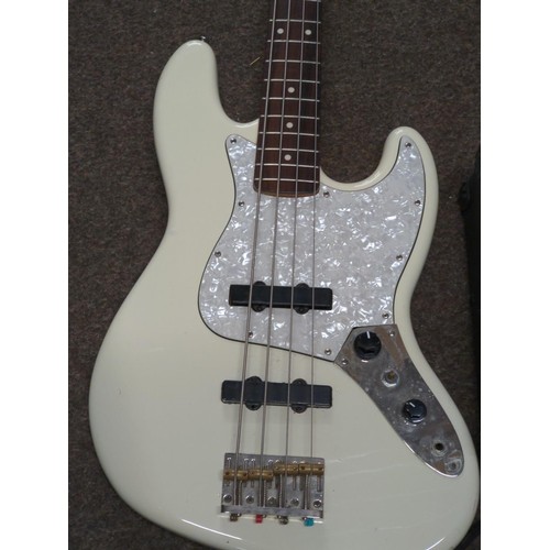 569 - Squire Fender Jazz Bass guitar made in China (s/n CGS0917090) along with a gear4music S158 amplifier... 