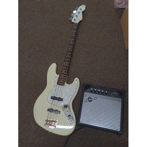 569 - Squire Fender Jazz Bass guitar made in China (s/n CGS0917090) along with a gear4music S158 amplifier... 