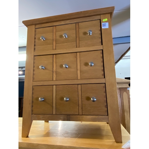 851 - Three drawer ( faux handles for 9 drawers) modern oak chest of drawers.