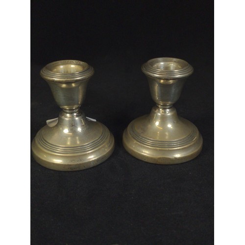 491 - Pair of silver candlesticks, Sanders & Mackenzie, Birmingham 1962, weighted, height 6.5cm, toget... 