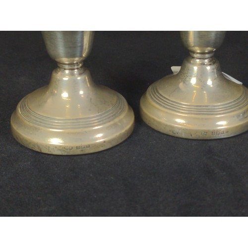 491 - Pair of silver candlesticks, Sanders & Mackenzie, Birmingham 1962, weighted, height 6.5cm, toget... 