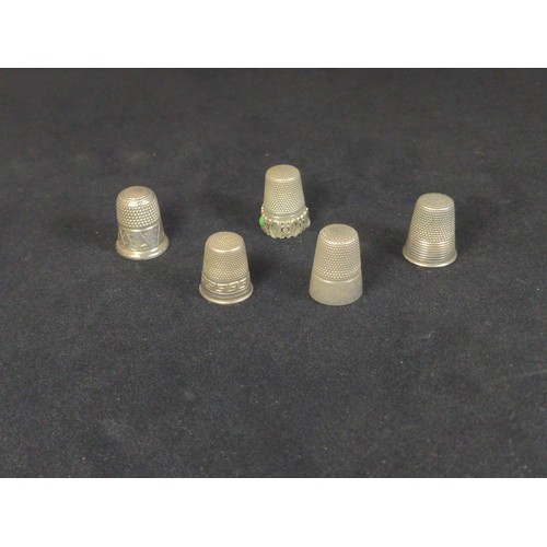 493 - Five thimbles, including silver, white metal etc.