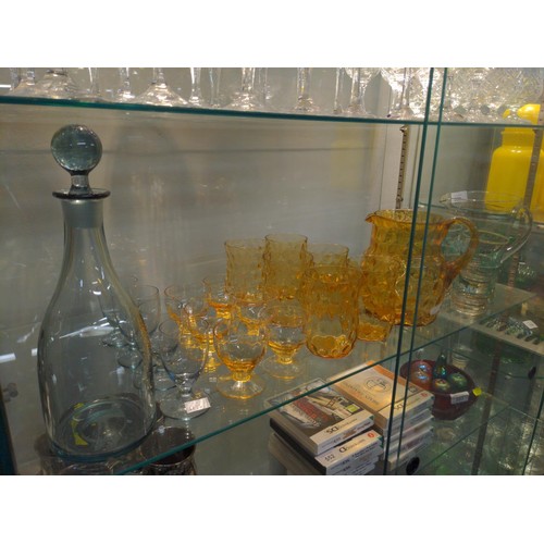 550 - Shelf load of coloured glass cordial and other sets