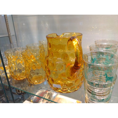 550 - Shelf load of coloured glass cordial and other sets