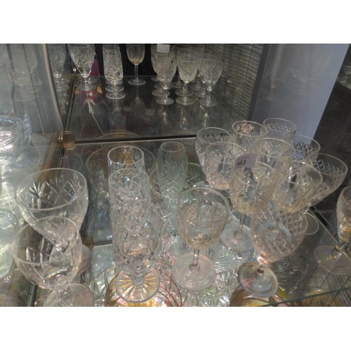 563 - 2 shelves of assorted cut and coloured glass