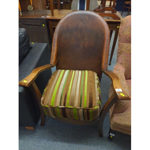 883 - Leather backed wooden armchair with deep upholstered cushion