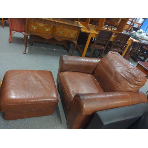 883 - Leather backed wooden armchair with deep upholstered cushion