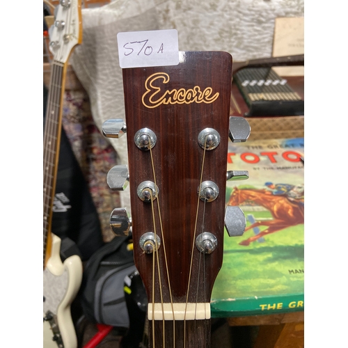 570A - Encore 6 string full size country style acoustic guitar model (W255) new strings plus another set of... 