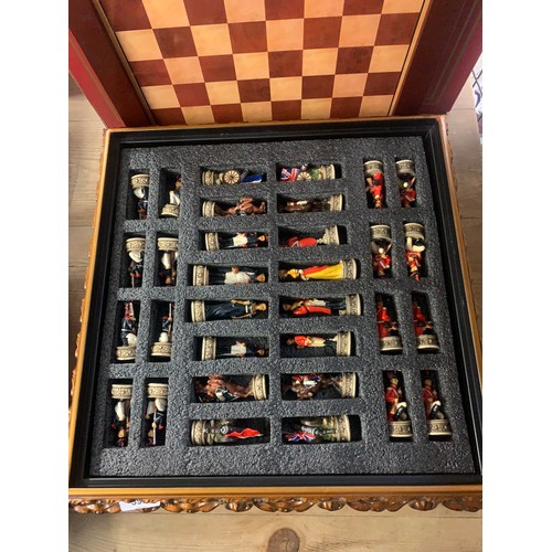 592 - Napoleonic themed chess set pieces stored in board